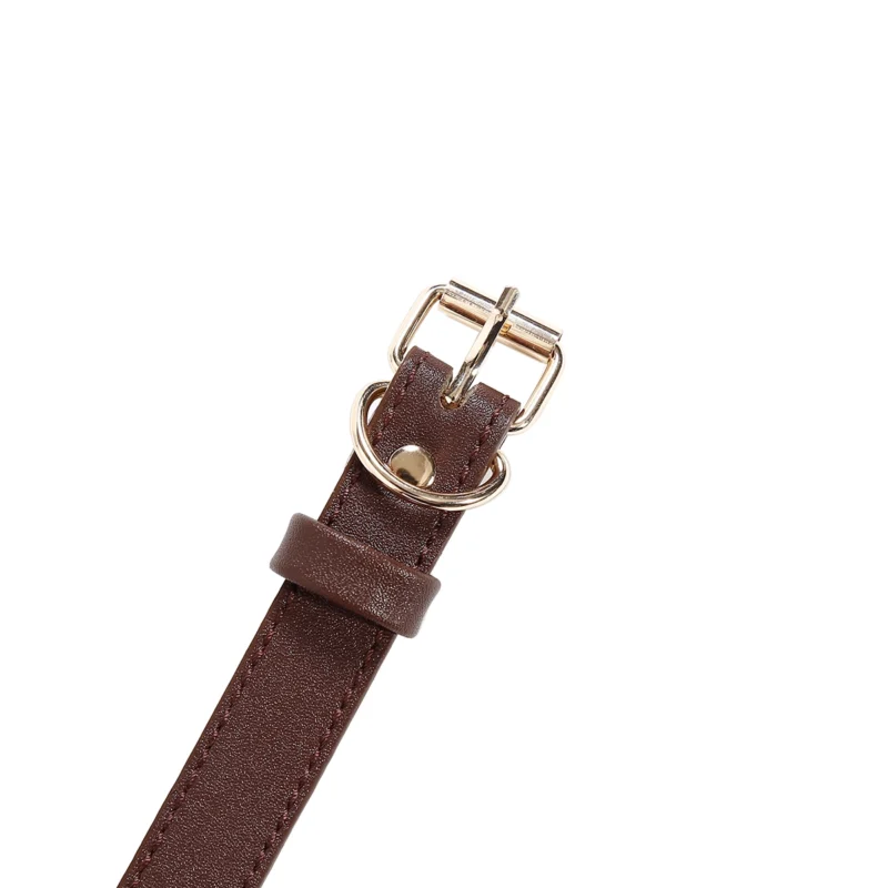 Close-up of PU leather bamboo bondage strap with metal hardware detailing