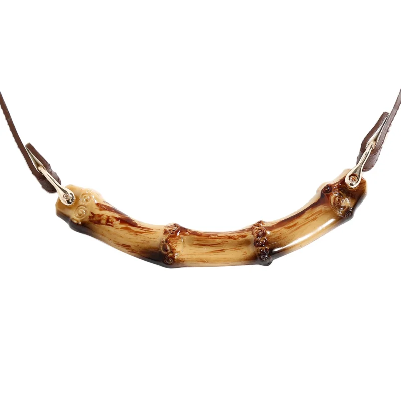 Close-up of bamboo segment on PU leather mouth gag, showing smooth surface and shape