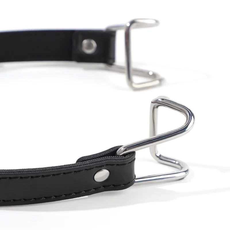 Close-up of metal hooks on mouth hook gag showing smooth curved design