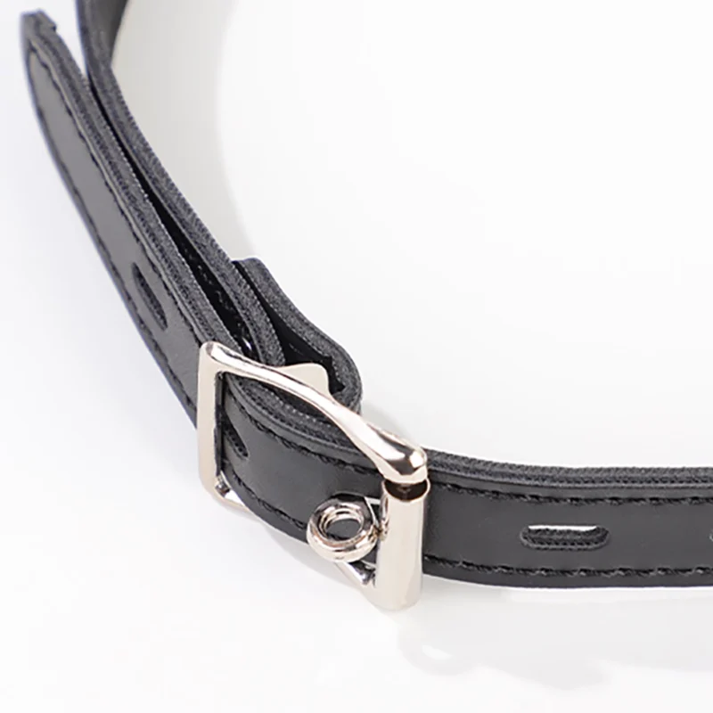 Detailed view of metal buckle hardware on mouth hook gag strap