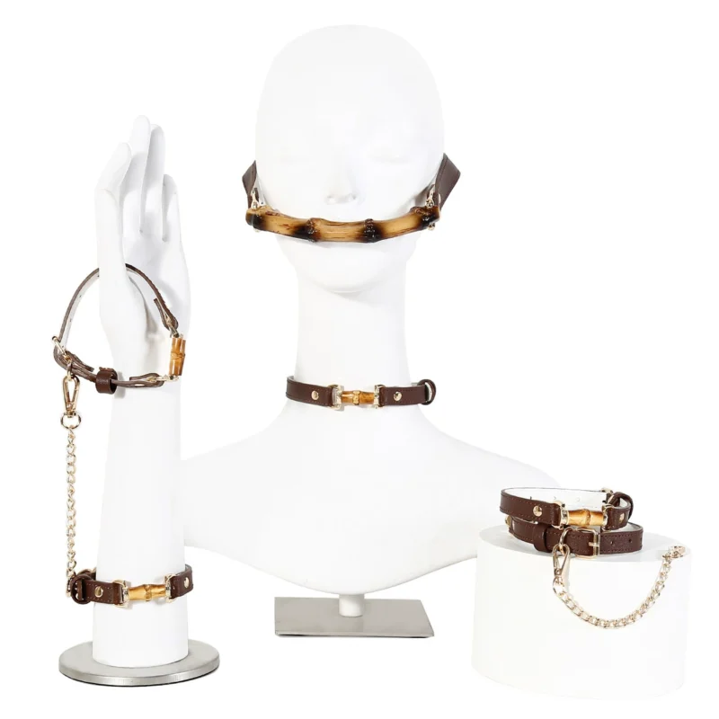 Full bamboo and PU leather bondage set on model, including gag, collar, wrist, and ankle cuffs