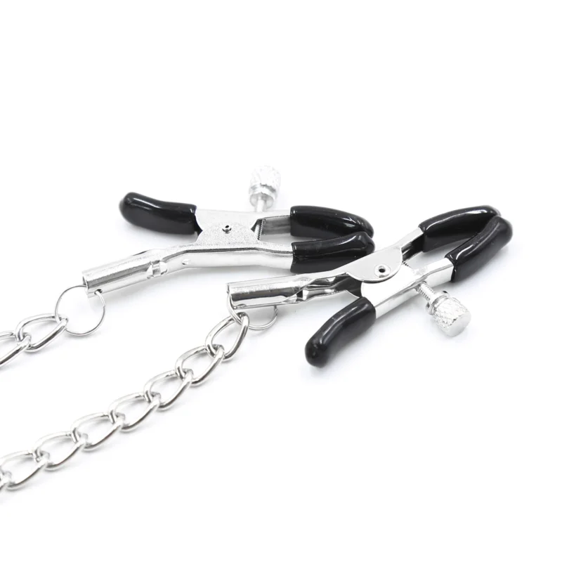Detailed view of nipple clamps attached to mouth gag showing adjustable tension