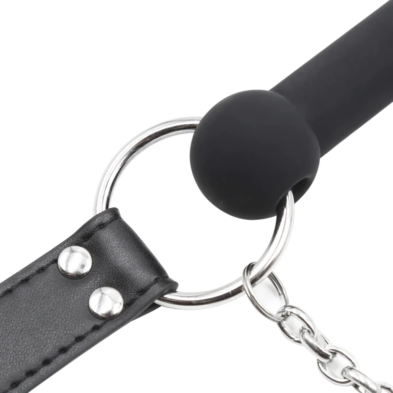 Close-up of silicone bit gag connected to PU leather strap, highlighting secure attachment