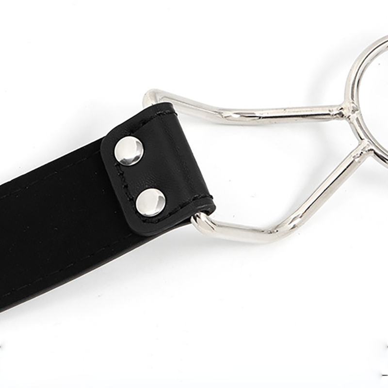 Close-up of metal O-ring connected to PU leather strap