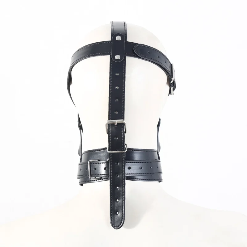 Rear view of penis gag bondage hood showing cross strap harness structure