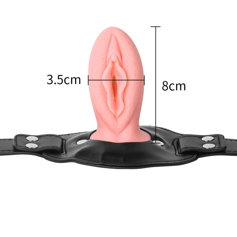 Realistic vulva-style mouth gag showing insert shape and size reference