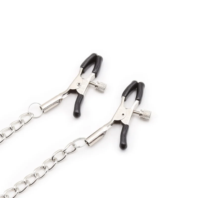 Close-up of adjustable nipple clamps on silicone O-ring mouth gag showing tension mechanism